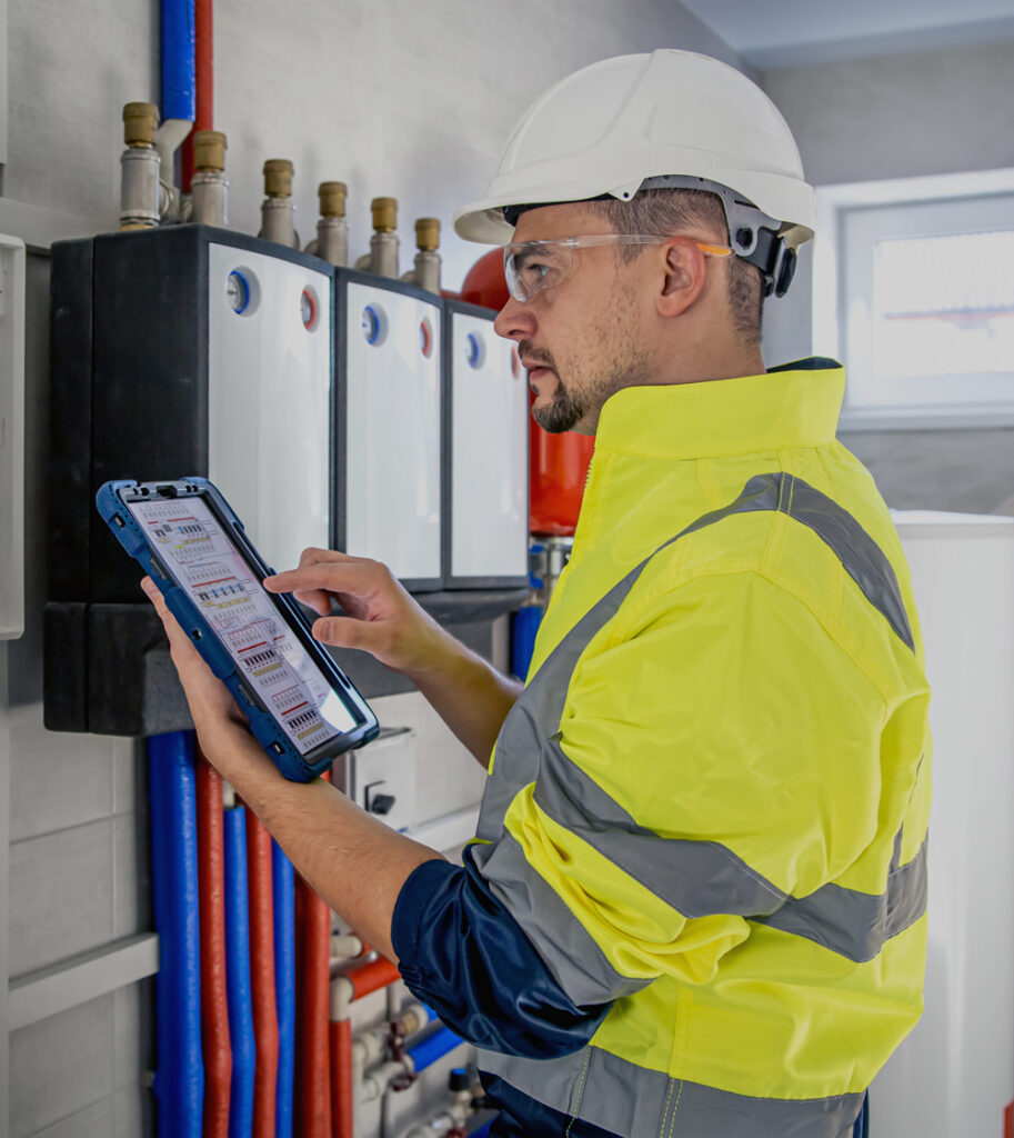 Engineer recording electrical test results on a tablet